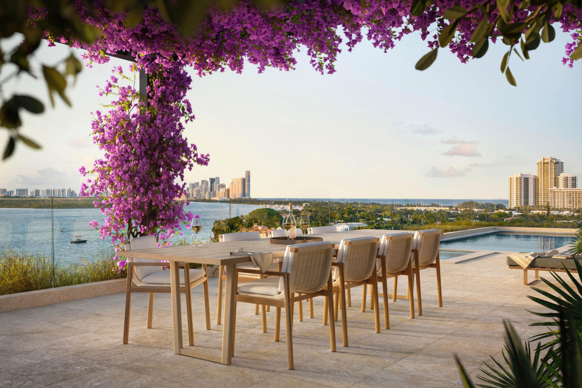 Penthouse outdoor dining with bougainvillea and bay view
