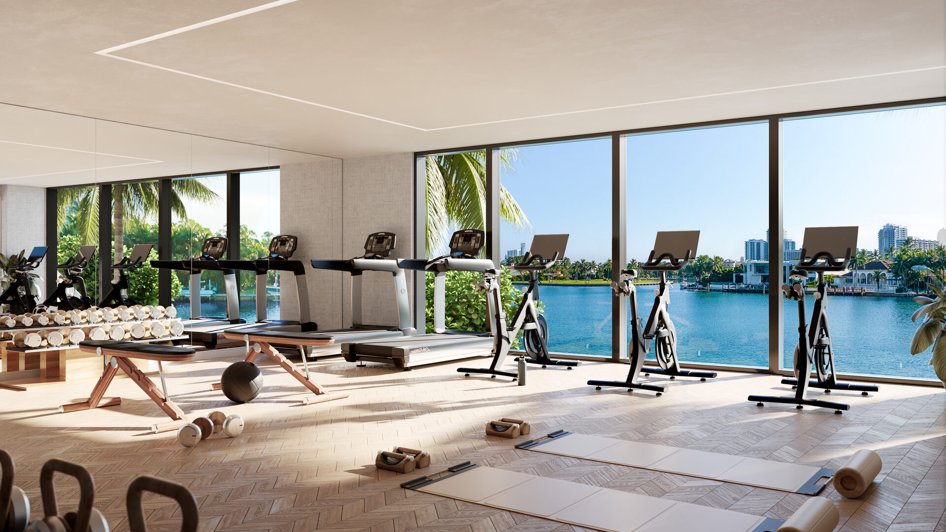 Bay Harbor Towers, a fitness room with equipment facing the waterfront windows, developer rendering